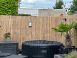 bamboemat gespleten in tuin